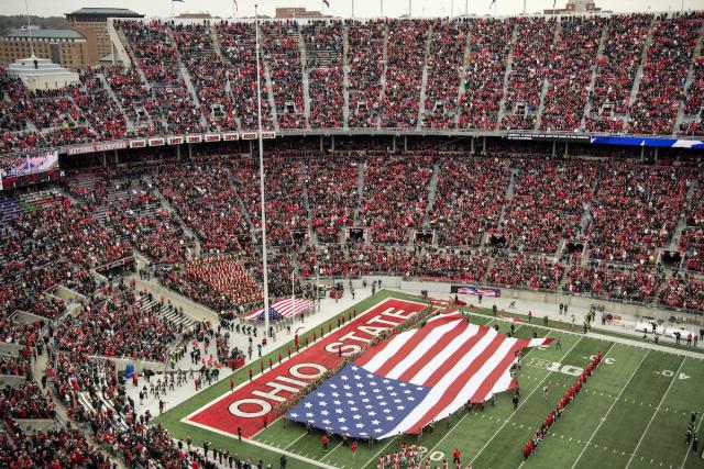 The American flag being unfurled at Ohio Stadium before a Buckeyes football game.