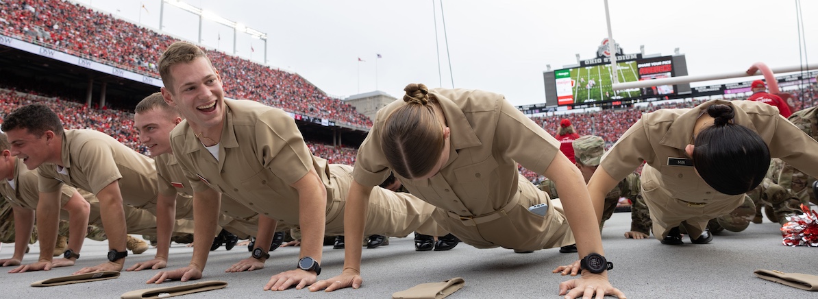 Cadets do pushups in Ohio Stadium after the Buckeyes football team scores a touchdown.