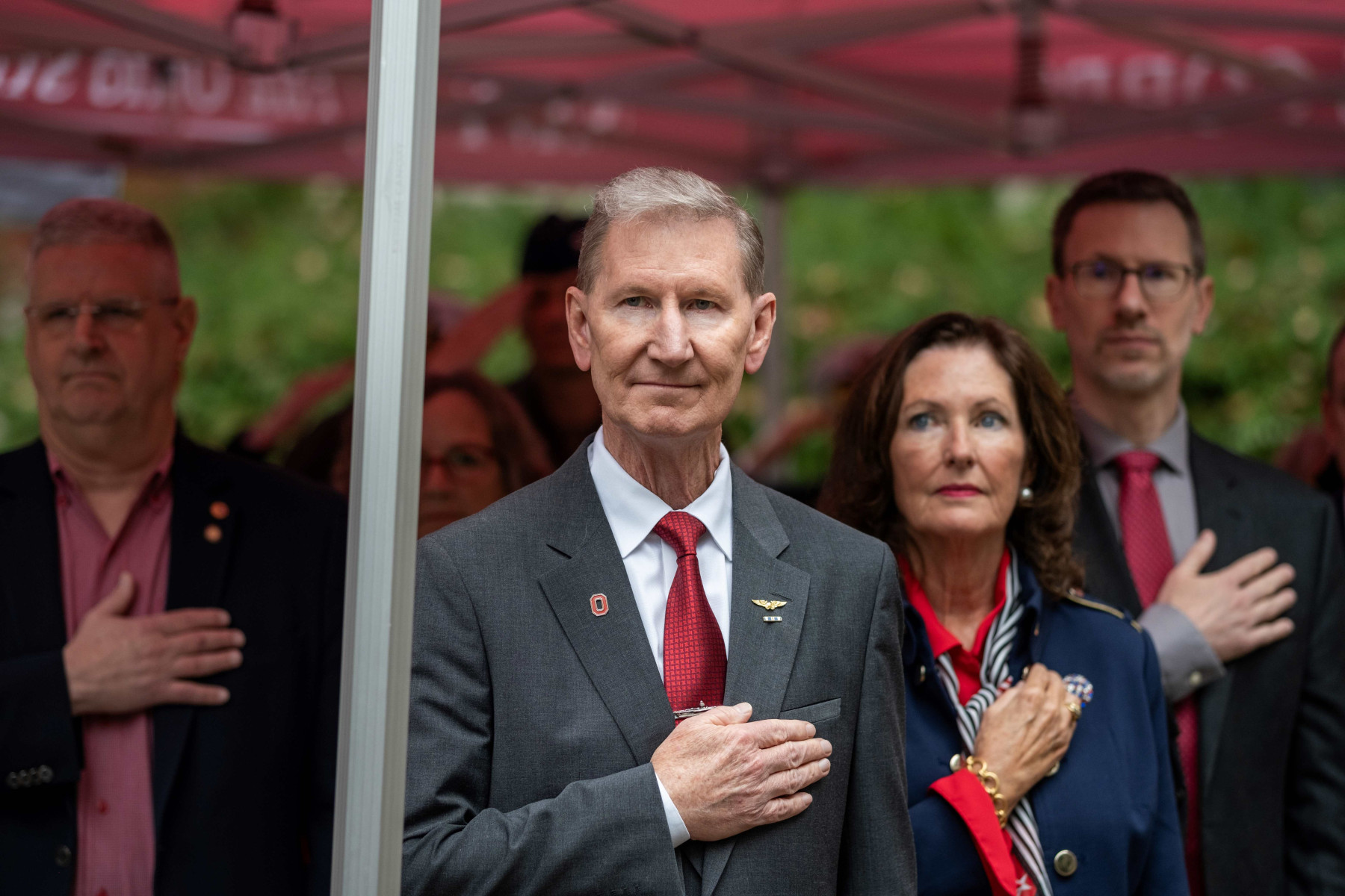 President Carter and first lady stand with hands over their hearts at the 2024 Rock Ceremony.