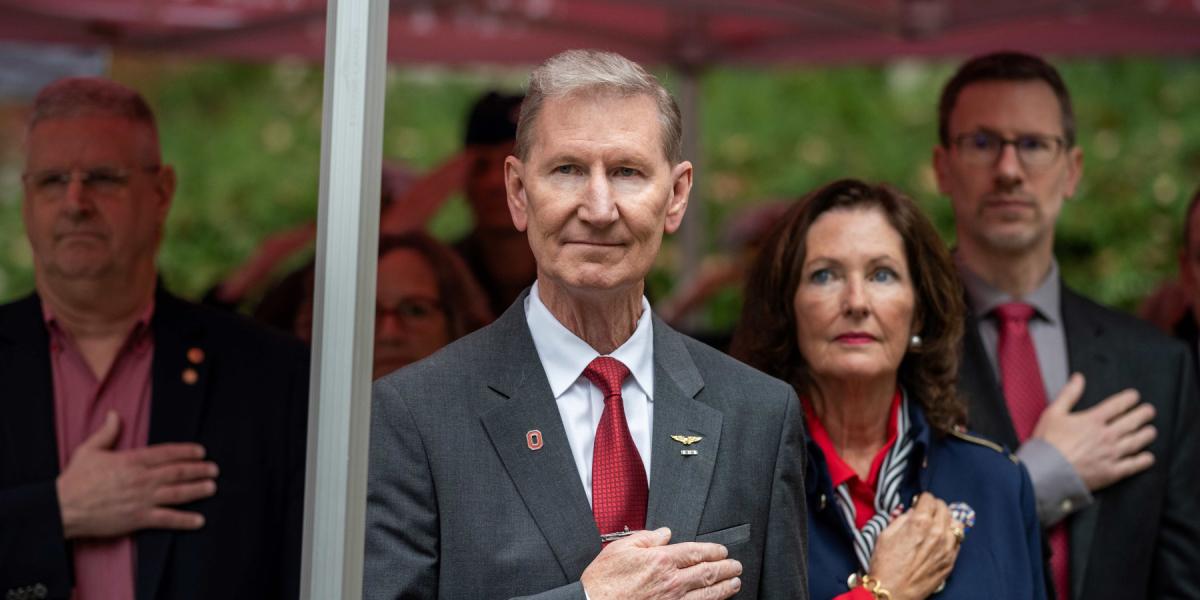 President Carter and first lady stand with hands over their hearts at the 2024 Rock Ceremony.