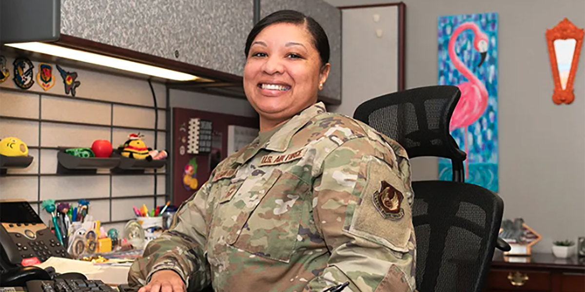 person dressed in U.S. Air Force uniform sitting in an office setting